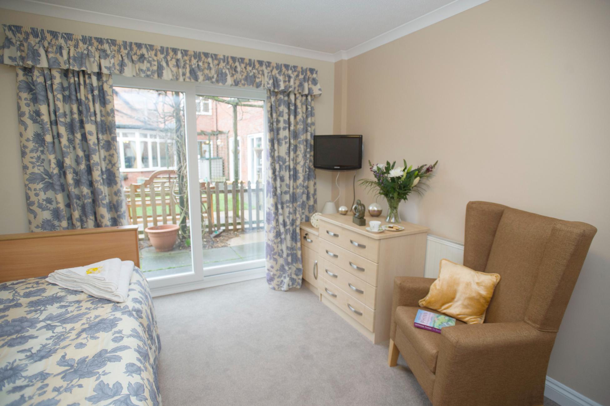 care home bedroom with garden patio