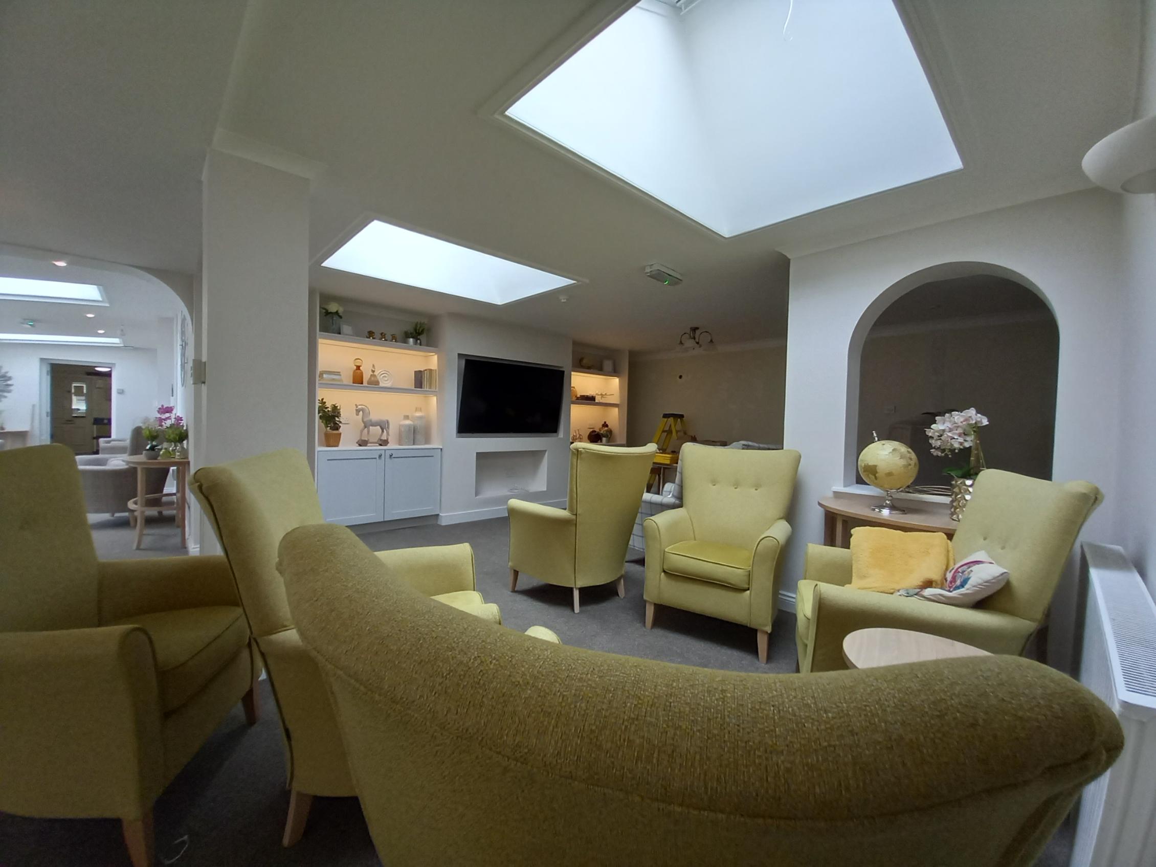 lounge with armchairs and skylight